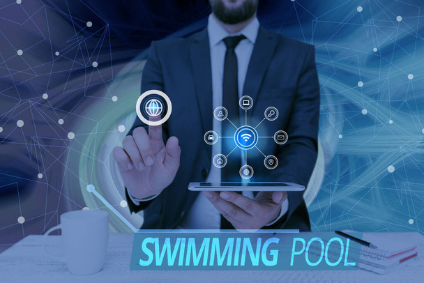 Conceptual display Swimming Pool. Business overview Structure designed to hold water for leisure activities Man holding Screen Of Mobile Phone Showing The Futuristic Technology. - 写真・画像