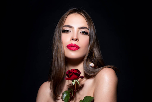 Sexy woman lips with red lipstick and beautiful red rose on black. - Fotoğraf, Görsel