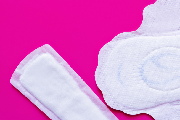 top view of different panty liners on purple background - Fotó, kép