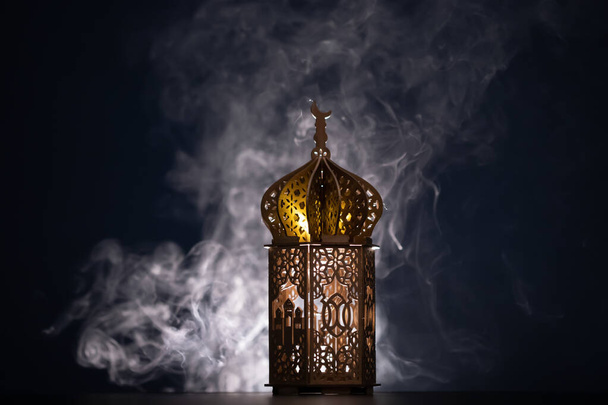 Ramadan Kareem background. Ornamental Arabic lantern glowing at night - Φωτογραφία, εικόνα