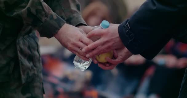 Soldiers Distributing Fruits And Water During War Problems. - Footage, Video