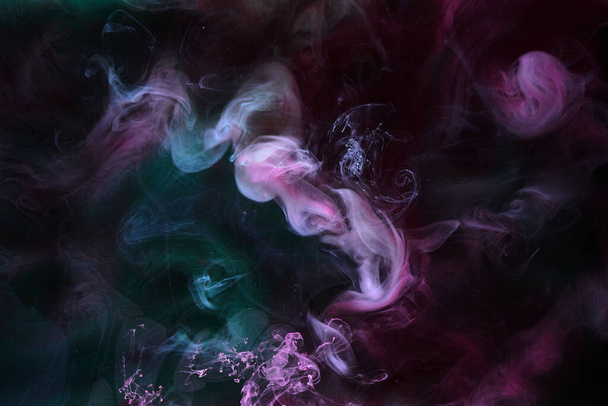 Multicolored dark smoke on black ink background, colorful fog, abstract swirling touch ocean sea, acrylic pigment paint underwater - Foto, immagini