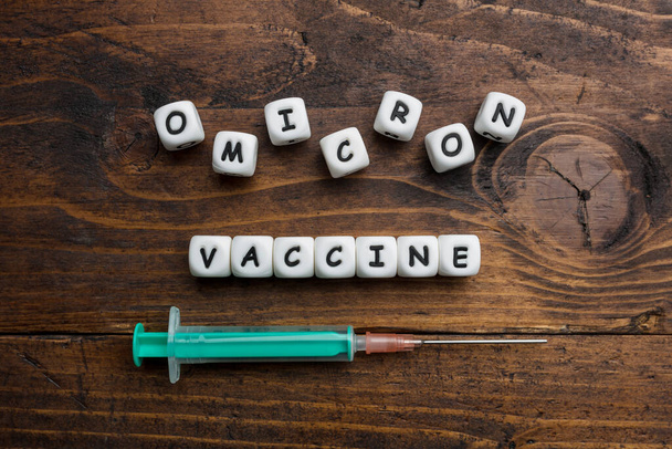 Corona virus Covid-19 vaccine text on wooden background  - Fotoğraf, Görsel