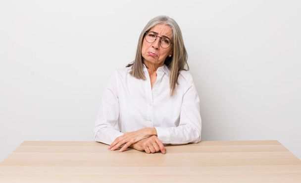 senior  gray hair woman feeling sad and whiney with an unhappy look and crying. desk and business concept - Foto, immagini