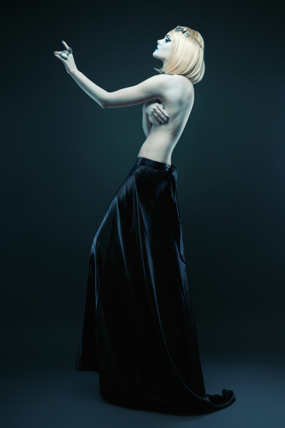 tall woman in black skirt - Фото, изображение