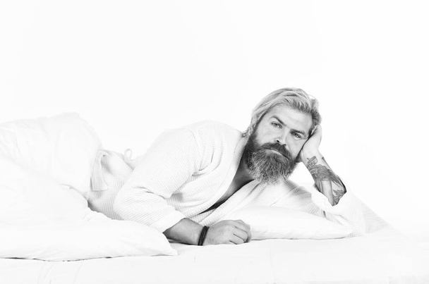 morning sex concept. mens health. man in bathrobe sleep in bed. tiredness and insomnia. brutal bearded hipster relax at home. cozy white bedroom. early wake up. lazy sunday - Foto, Imagen