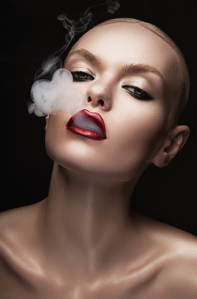 hot woman with smoke in mouth - Φωτογραφία, εικόνα