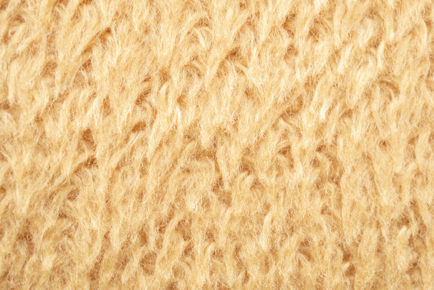 sárga bolyhos szőrme szövet gyapjú textúra háttér - Fotó, kép