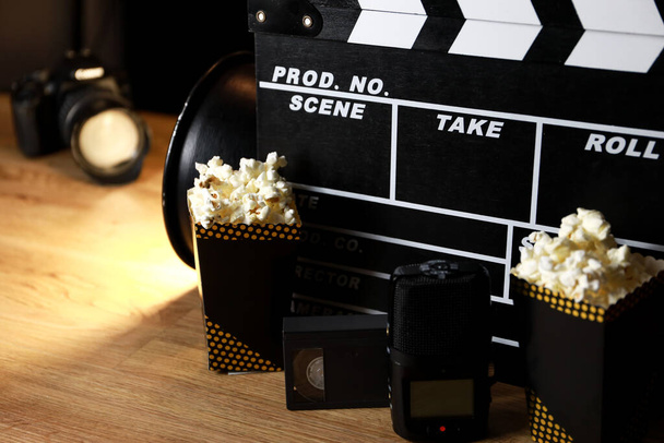 clapperboard for film shooting, with popcorn you feel more like going to the cinema - Photo, Image