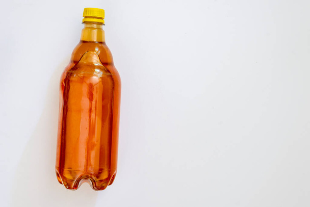 Bee honey inside a plastic bottle. Salvador, Bahia, Brazil. - Zdjęcie, obraz