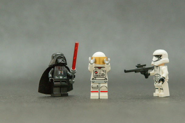 Bauru, Brazil. September, 15, 2019: Darth Vader and a Stormtrooper rendering an astronaut lost in space. Evil over good. Lego minifigures are manufactured by The Lego Group. - Foto, Imagen