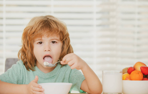 Funny kid with plate of soup. Child dinner. - Photo, Image