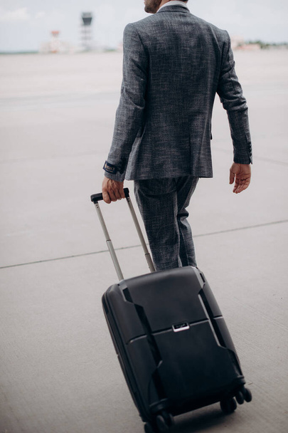 man with a suitcase at the airport - Photo, Image
