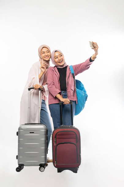 muslim woman ready for vacation during eid mubarak holiday take selfie and video calling - Photo, Image