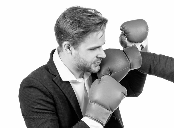 Professional man businessman in formal suit got blow in jaw by boxing glove isolated on white, punch - Photo, Image