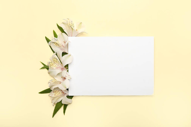 Composition with blank sheet of paper and alstroemeria flowers on color background - Fotoğraf, Görsel
