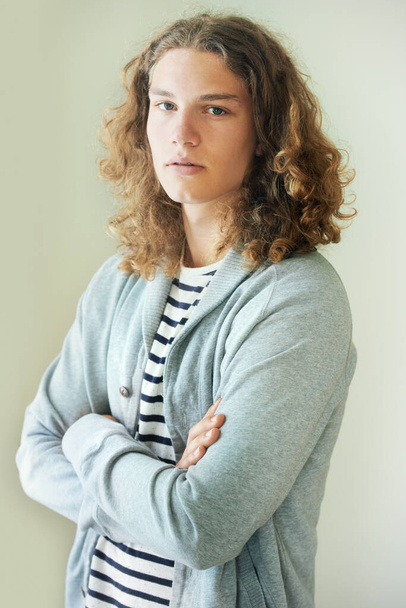 Keeping things casual. Casual young man with long, curly hair. - Φωτογραφία, εικόνα