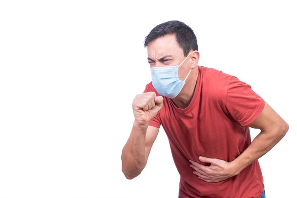 Man in medical mask coughing during COVID pandemic - 写真・画像