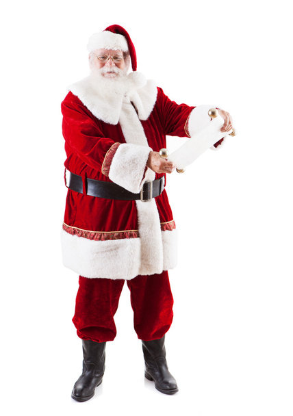 Santa Claus Looking At The Naughty And Nice List - Photo, Image