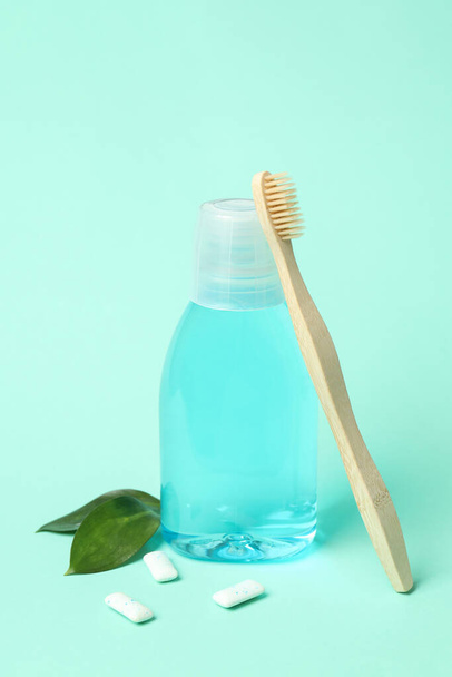 Concept of tooth or oral care on mint background - Photo, Image