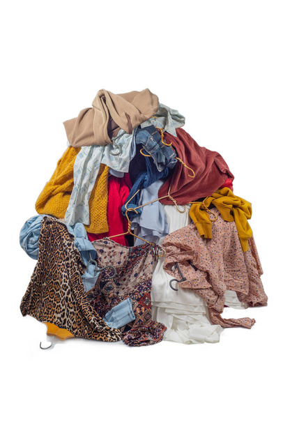 Pile with used clothes. The concept of sustainable fashion. Pile of used clothes on a light background. Second hand for recycling - Foto, Imagem