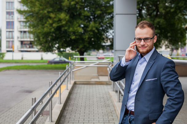 Businessman talking by phone - Fotó, kép