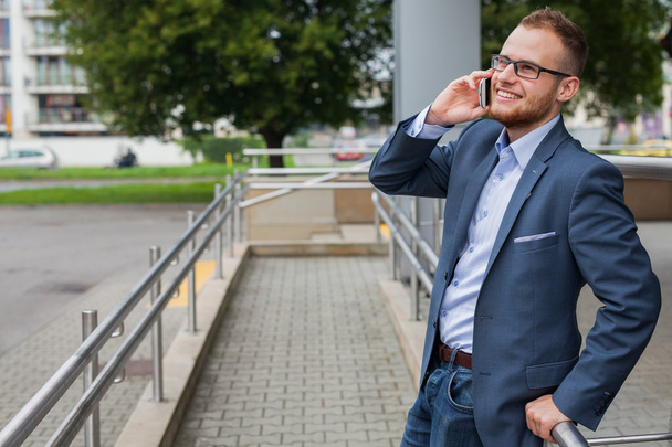 Businessman talking by phone - Fotoğraf, Görsel