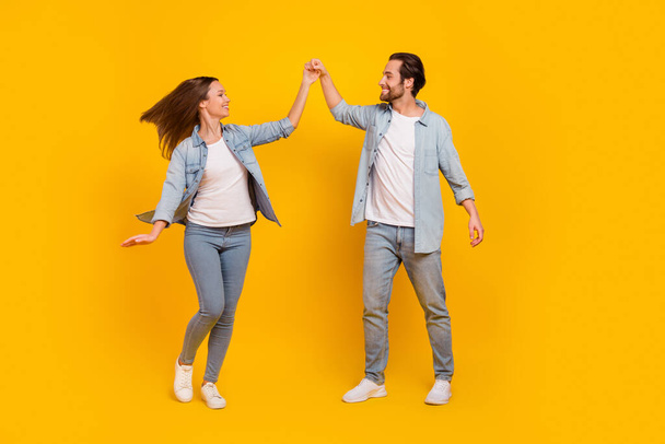 Full length body size view of attractive cheery funny people dancing pastime isolated over bright yellow color background - Photo, Image