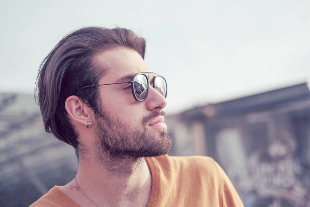 beautiful Italian dark-haired guy with mirrored sunglasses. High quality photo - Photo, Image