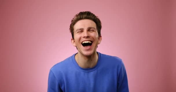 Portrait of young man laughing - Footage, Video