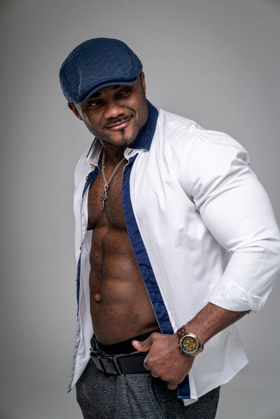 Sexy man model posing in casual clothes. Stylish strong person showing his muscles. - 写真・画像