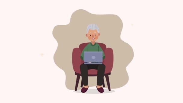 abuelo utilizando el ordenador portátil en la animación de personajes sofá - Metraje, vídeo