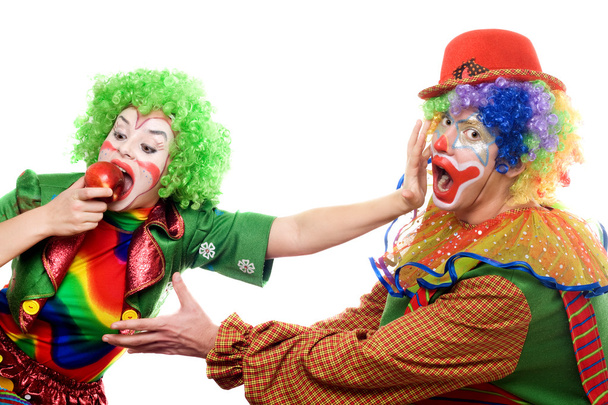 Clowns kämpfen um einen Apfel - Foto, Bild