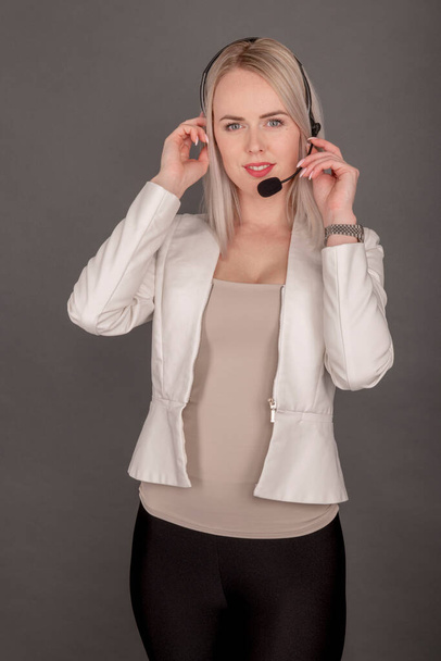 Call customer center operator woman isolated over dark background - Photo, Image