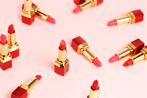 number of red lipsticks on pink surface - Valokuva, kuva