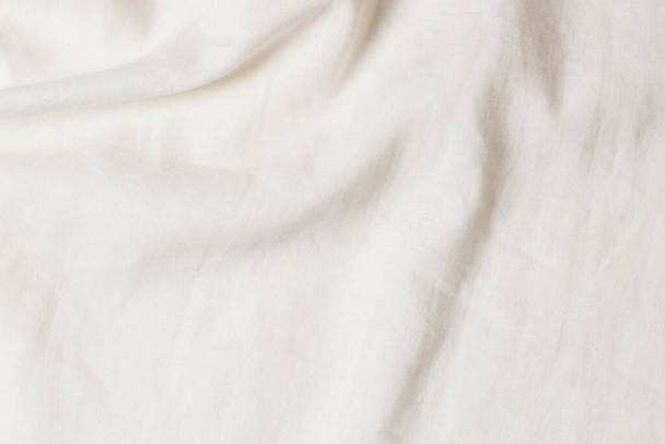 White crumpled linen fabric texture background. Natural linen organic eco textiles canvas background. Top view - Photo, Image