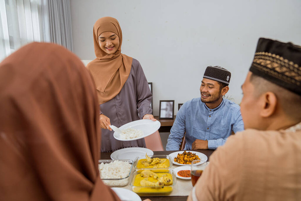 asian muslim friend and family break fasting together - Фото, зображення