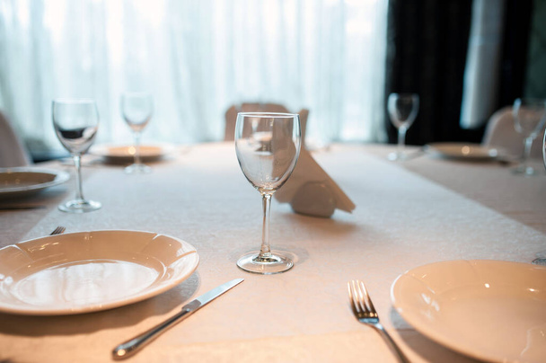Empty plate, glasses and silverware set on wooden table - Φωτογραφία, εικόνα