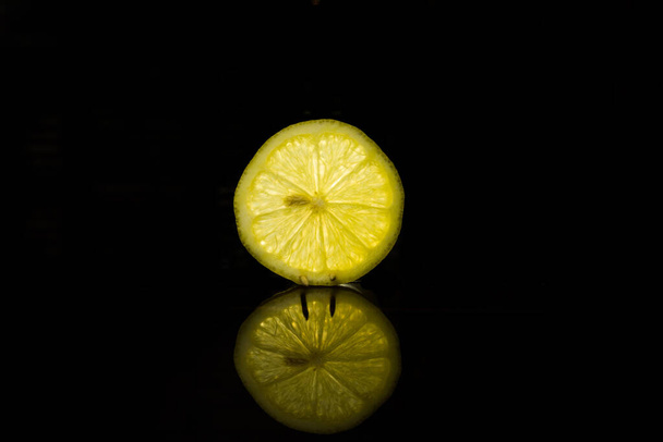 lemon isolated on black background - Foto, afbeelding