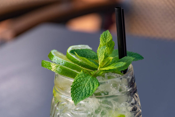 mojito cocktail with mint and ice on a dark background - Photo, Image