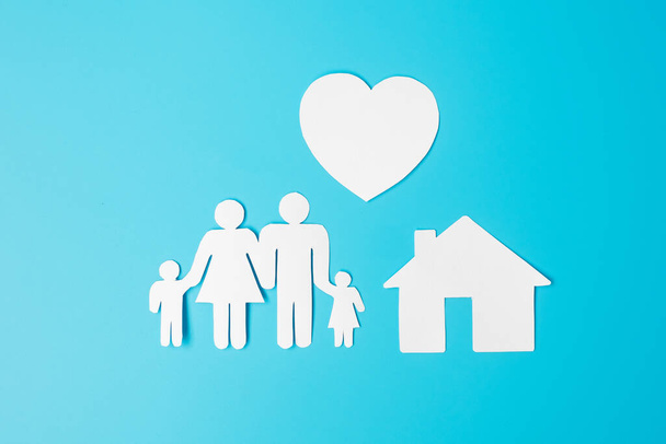 Happy Family day. paper shape cutout with Father, Mother, Children, Home and Heart. international day of families, Warm home, love, Insurance, Life and Wellness concepts. - Fotó, kép