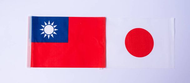 Taiwan against Japan flags. freindship, war, conflict, Politics and relationship concept - Photo, Image