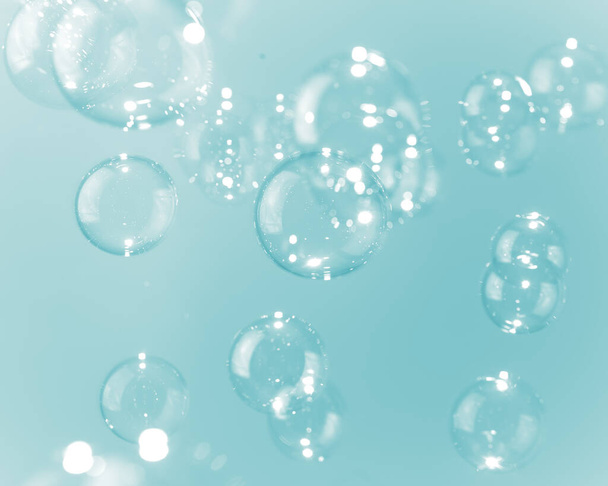 Beautiful Shiny Transparent Blue Soap Bubbles Background. Soap Suds Bubbles Water - 写真・画像