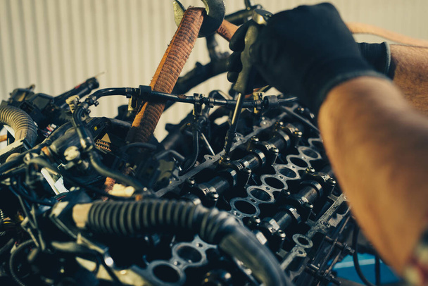 Auto mechanic working and repair on car engine in mechanics garage - Photo, Image