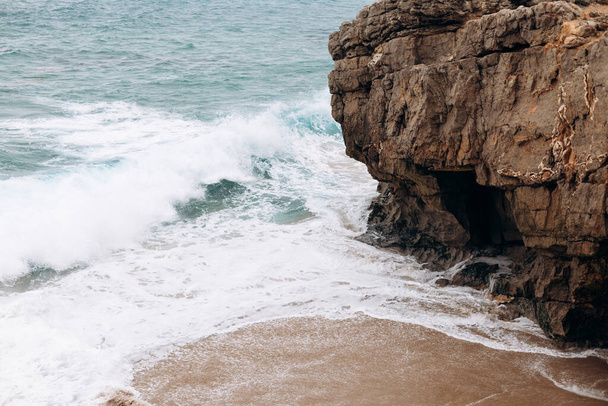 Waves crashing against shoreline on Beach.view over Atlantic ocean coast, Cabo da Roca, Portugal - Photo, Image