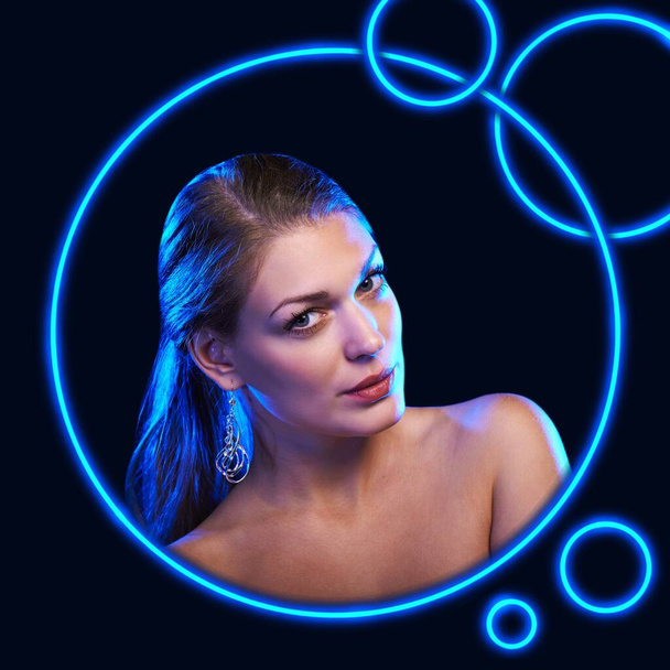 Modern beauty portrait of a woman with blue neon circles - Valokuva, kuva