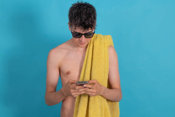summer isolated teenager boy with mobile phone - Foto, Imagen