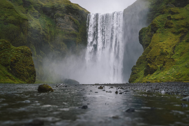 Famous and most visited Skogafoss waterfall in Iceland at evening light. - Fotó, kép