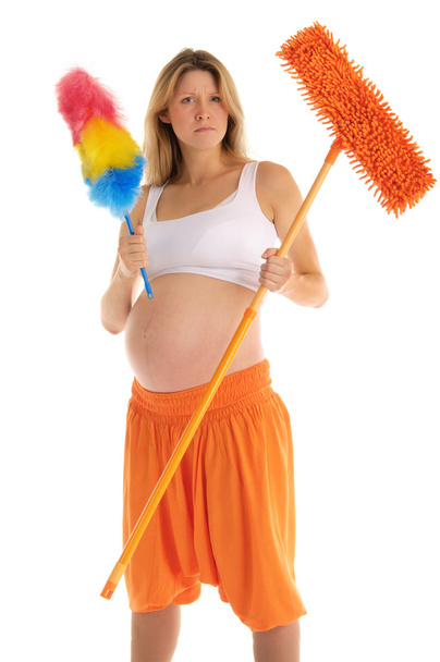 Angry pregnant woman with a mop - Photo, image