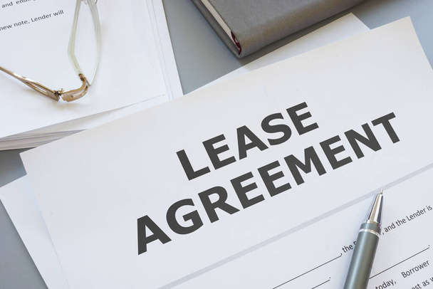Lease agreement is shown on a photo using the text - Photo, Image